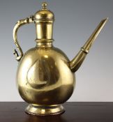 A large 18th century Mogul brass ewer, with bird and beast handle, 15in. Starting Price: £160