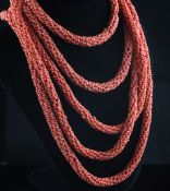 A large multi bead single strand coral necklace, 89in. Starting Price: £240