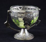 A WMF Art Nouveau sugar basket, with swing handle and pale green glass liner, marks to the base,