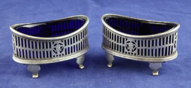 A pair of George V pierced silver oval boat shaped salts, Goldsmiths & Silversmiths Co Ltd,