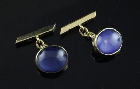 A pair of 18ct gold and oval cabochon blue quartz cufflinks, gross 13.1 grams. Starting Price: £240