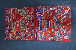 Four Oriental embroidered silk panels, the first pair Japanese, decorated with peacocks and