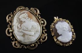 A Victorian gold mounted oval cameo brooch, carved with Hebe and the Eagle, in pierced scroll mount,