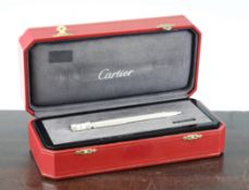 A Cartier Limited Edition platinum plated ballpoint pen / watch, the watch with quartz movement,