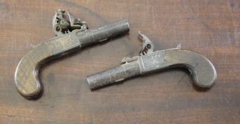 A pair of early 19th century pocket pistols, one marked to the side plate E. Baker, London, with