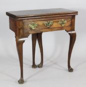 A George II walnut folding tea table, with frieze drawer, on cabriole legs, W.2ft 4in.Provenance: