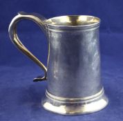 A George III provincial silver mug, of restrained tapering form, with engraved monogram and scroll
