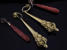 A pair of 19th century gilt drop earrings, of tapering form with pierced foliate terminals, 3.5in