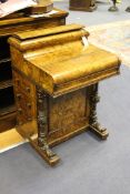 A Victorian figured walnut piano top davenport, with four side drawers opposing four dummy drawers