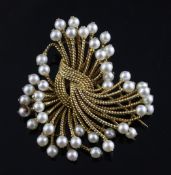 A 1960`s? gold and cultured pearl set brooch, of spray form, apparently unmarked, 2in gross 20.4