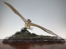 Ch. Ruchot. A French Art Deco bronze figure of a seagull on the crest of a wave, the stepped