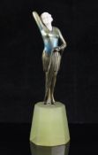 Josef Lorenzl (1892-1950). An Art Deco silvered bronze and ivory figure of a standing woman,