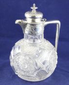 A late Victorian silver mounted cut glass claret jug, of globular form, with angular handle and