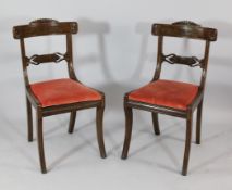 A set of eight Regency mahogany dining chairs, with pierced anthemion spar backs, drop in seats