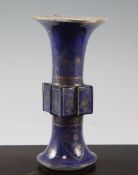 A Chinese gilt-decorated powder blue beaker vase, Gu, Kangxi period, decorated with flowers and