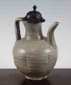 A Chinese Yueyao ewer, Song Dynasty, with globular body, curved spout and ribbed loop handle,