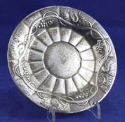 A 1920`s Georg Jensen sterling silver wine coaster, design no.394, with planished decoration and