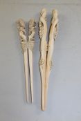 Two pairs of ivory glove stretchers, late 19th century, the first with handles carved as tree