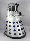 A full size replica of a Dr Who Dalek in silver and blue, 5ft 6in. Starting Price: £400