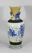 A large Chinese crackleglaze ovoid vase, with carved brown borders painted in underglaze blue with