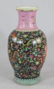 A large Chinese famille rose `dragon` vase, Republic period, decorated with dragons amid