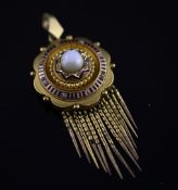 A Victorian gold, diamond and blue enamel target pendant locket, with tassel drops, overall 2.5in.