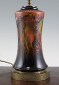 A Moorcroft flambe `Leaf and Berry` pottery lamp base, of waisted cylindrical form, gilt metal