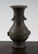 A Chinese bronze pear shaped vase, 18th / 19th century, decorated with archaistic bands, 6.3in.