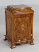 A satinwood and rosewood crossbanded pedestal cupboard, with oval inlaid paterae decoration, with