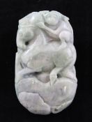 A Chinese jadeite carving of a monkey riding a horse, the white stone with grey and green