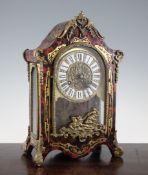 A 19th century French Louis XV style red boulle mantel clock, with enamelled tablet numerals, 14.