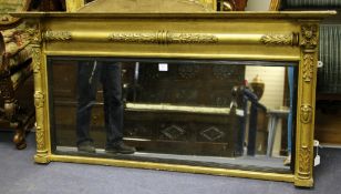 An early 19th century gilt landscape mantel mirror, with stiff leaved carved columns and floral