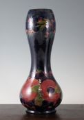 A large Moorcroft `Pomegranate` double gourd shaped vase, c.1916, with green and cobalt blue mottled