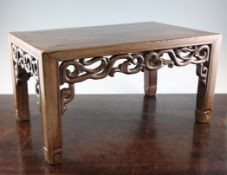A late 19th century Chinese rosewood square low table or stand, with traditional scrolling pierced
