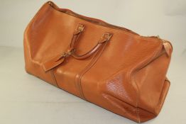 A brown leather Louis Vuitton travel bag Starting Price: £120