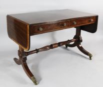 A George IV mahogany and satinwood banded sofa table, with two drawers opposing two dummy drawers