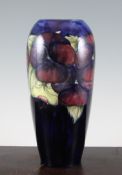 A Moorcroft `Pansy` tall ovoid vase, c.1918-29, with cobalt blue ground, inscribed `W Moorcroft`