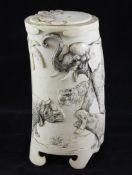 A Japanese ivory tusk vase and cover, early 20th century, carved in high relief with a gorilla,