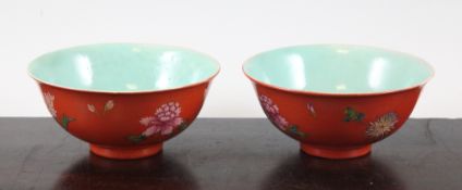 A pair of Chinese coral ground bowls, Daoguang mark but Republic period, painted with sprays of