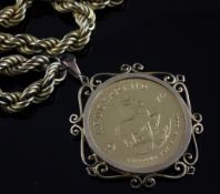 A 1974 gold krugerrand in a 9ct gold pendant mounted, on an unmarked gold rope twist chain, gross 84