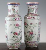 A pair of Chinese famille rose rouleau vases, late 19th / early 20th century, each painted with