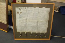 A George II indenture, printed and inscribed on a single sheet of vellum with a large circular wax