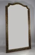 A late 19th century parcel gilt ebonised wall mirror, with bevelled plate glass, H.6ft 10in. W.3ft