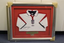 A framed and glazed signed David Beckham England football shirt, limited edition, 9/10, 3ft 1in.