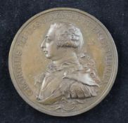 A George III bronze medal, by C.H. Kuchler, with bust of George III and reverse with alter and the