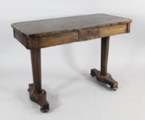 A George IV rosewood writing table, with small single frieze drawer and two side drawers, on