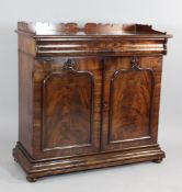 A Victorian mahogany side cabinet, with cushion shaped single drawer over two panelled doors, W.