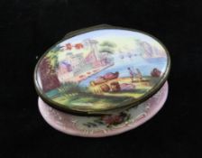 A 19th century South Staffordshire pink enamel oval trinket box, the lid decorated with a harbour