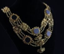 An ornate 19th century gilt metal cannetile work and bloodstone panel set necklace, 16.75in.