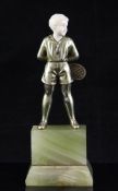 Josef Lorenzl (1892-1950). A small gilt bronze and ivory figure of a boy with a tennis racket, on